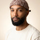 Bonnet docker Bandana beige porté par un homme, portrait