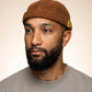 Bonnet docker Believe marron porté par un homme, portrait
