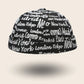 Bonnet docker Cosmopolitain noir imprimé noms de villes, vue de face