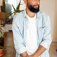 Bonnet docker en coton kaki porté par un homme, intérieur avec plantes