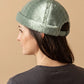 Bonnet docker Effet Laine vert porté par une femme, vue de dos sur la fermeture