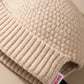 Gros plan sur la matière du bonnet docker Grosse Maille beige
