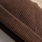 Gros plan sur la matière du bonnet docker Hiver noir