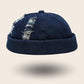 Bonnet docker en Jean bleu marine effet délavé et déchiré, vue de face
