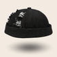 Bonnet docker en Jean noir effet délavé et déchiré, vue de face