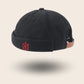 Bonnet docker Marin noir, vue de dos avec gouvernail brodé