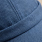 Gros plan sur la matière du bonnet docker Original en Coton vert foncé